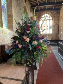 Pedestal arrangement burgundy and blues